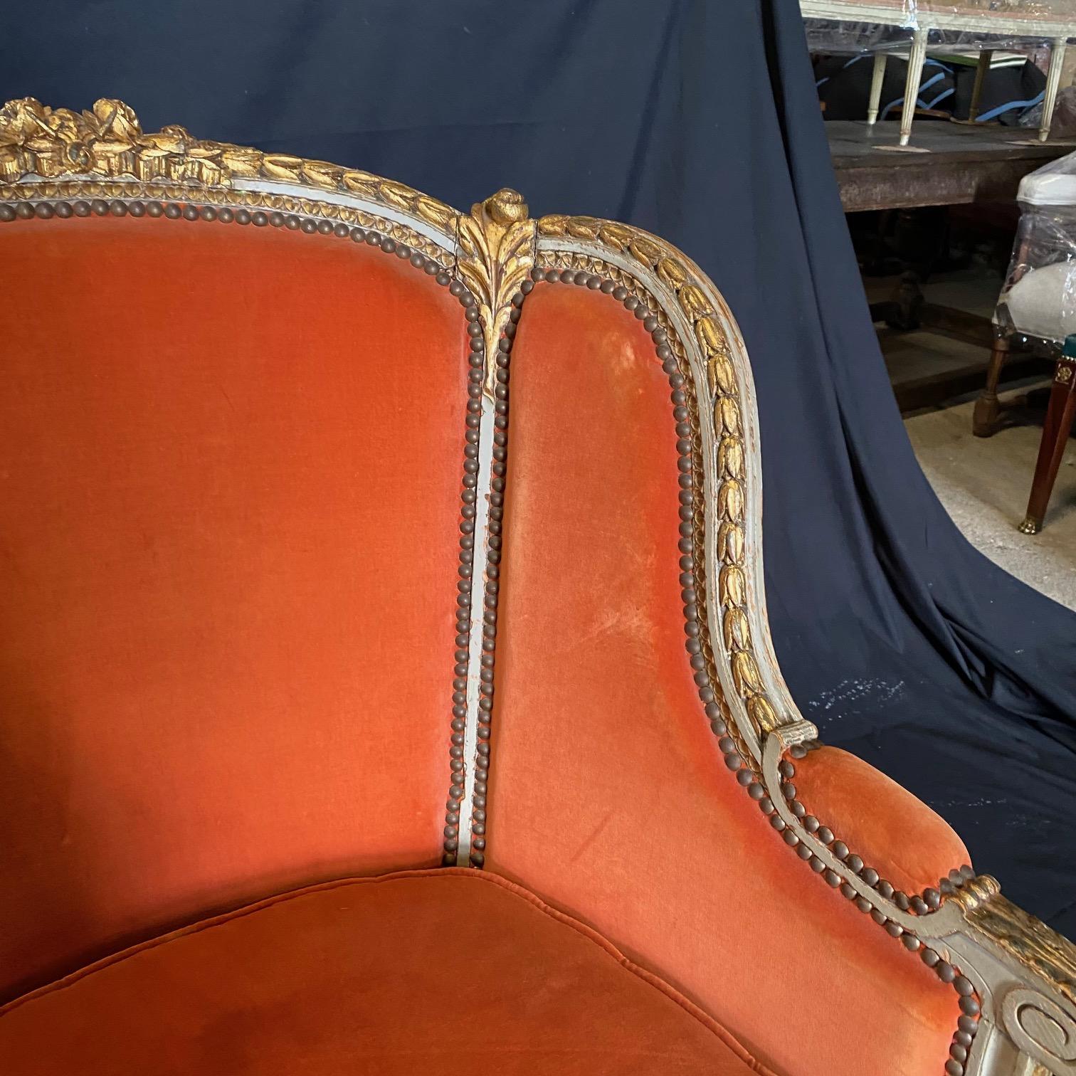 19th Century French Louis XVI Pair of Carved and Gilded Velvet Wingback Chairs