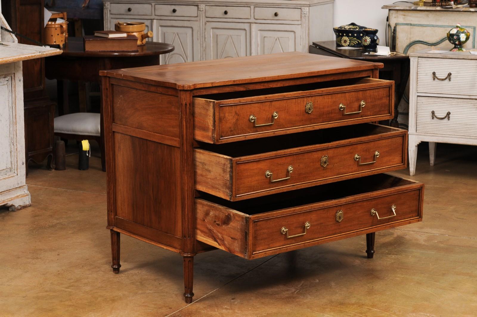 18th Century French Louis XVI Period 1790s Walnut Three Drawer Commode with Fluted Side Posts For Sale