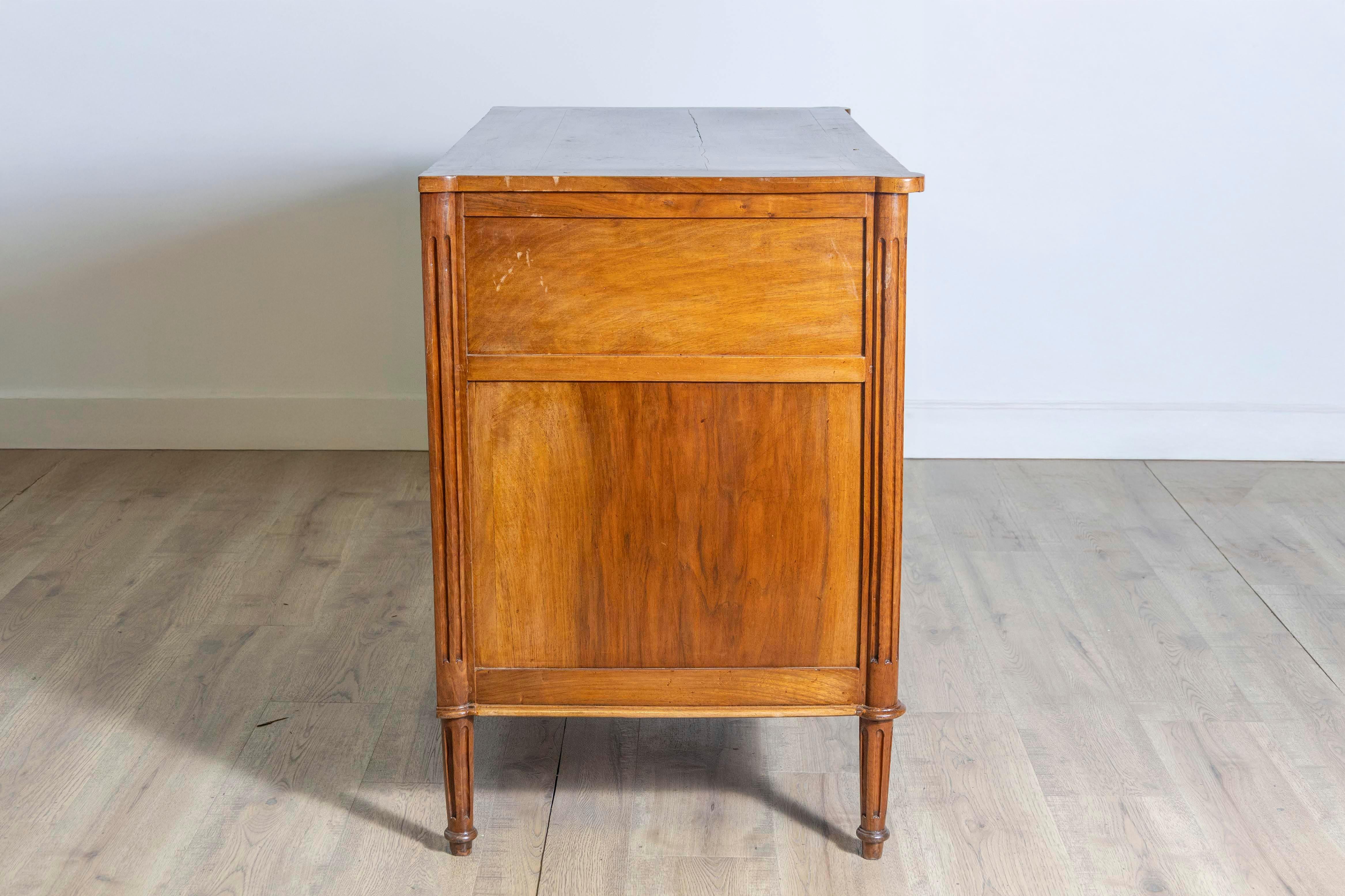 18th Century French Louis XVI Period 1790s Walnut Three Drawer Commode with Fluted Side Posts For Sale
