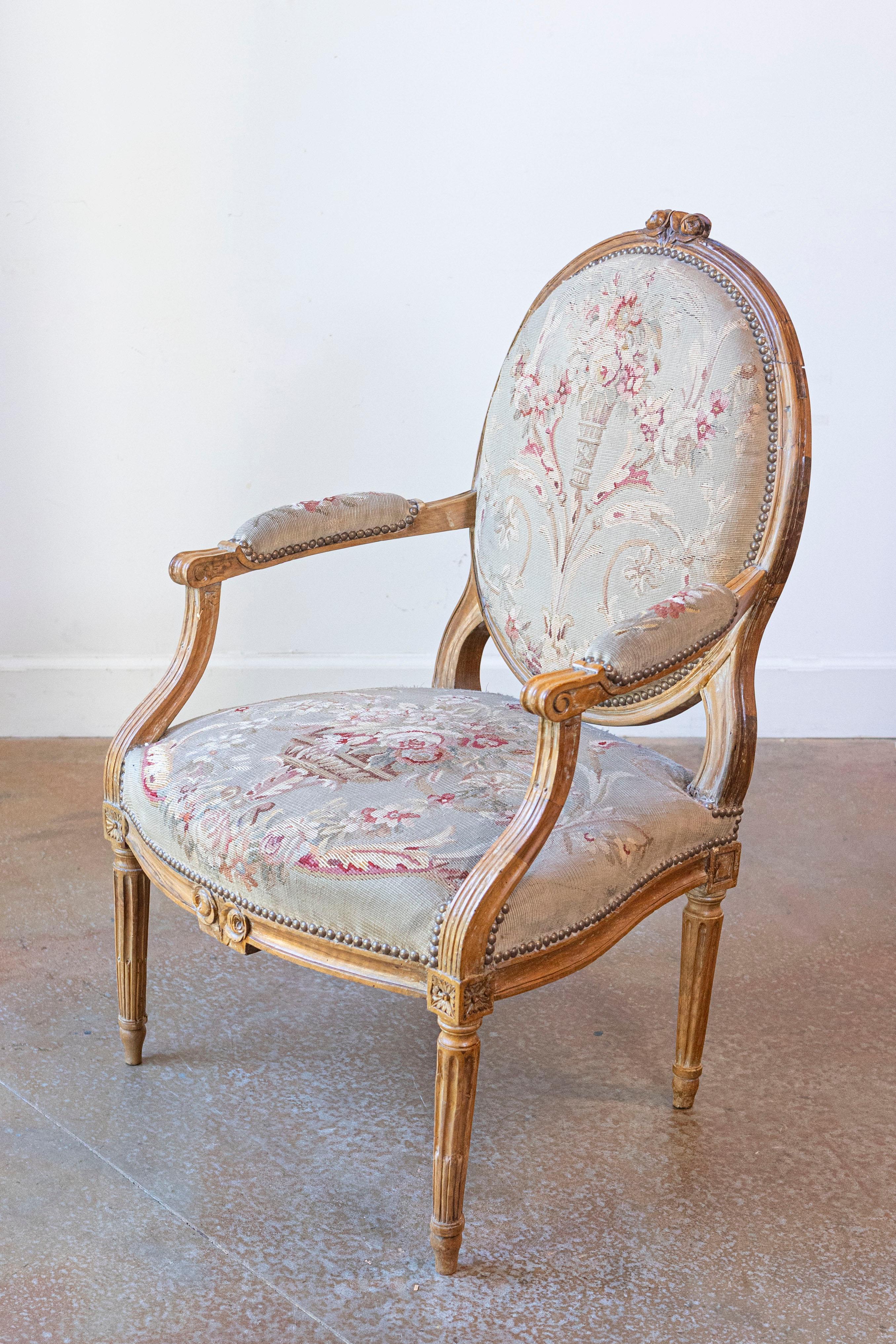 Carved French Louis XVI Period 18th Century Armchair with Floral Tapestry Upholstery For Sale