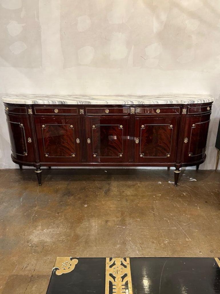 Fine French Louis XVI design flame mahogany and gilt brass sideboard. Circa 1940. Perfect for today's transitional designs!