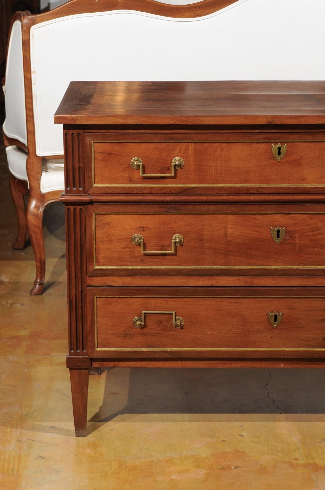 French Louis XVI Style 1840s Walnut Three-Drawer Commode with Brass Accents In Good Condition In Atlanta, GA