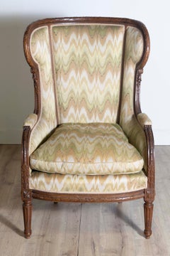 French Louis XVI Style 1870s Walnut Bergère à Oreilles with Carved Décor