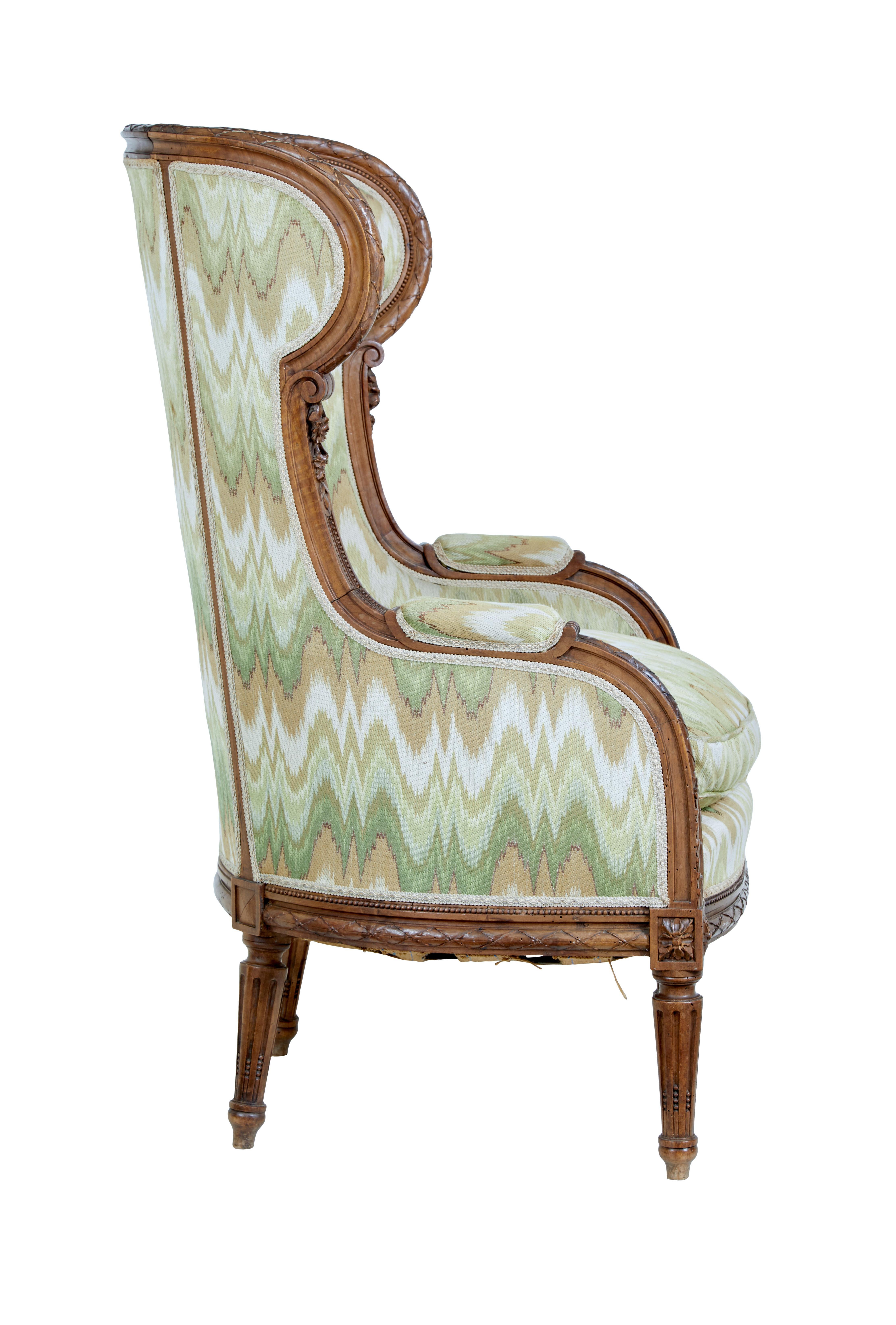 French Louis XVI Style 1870s Walnut Bergère à Oreilles with Carved Décor In Good Condition For Sale In Atlanta, GA