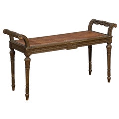 French Louis XVI Style 1880s Carved Bench with Cane Seat and Scrolling Arms