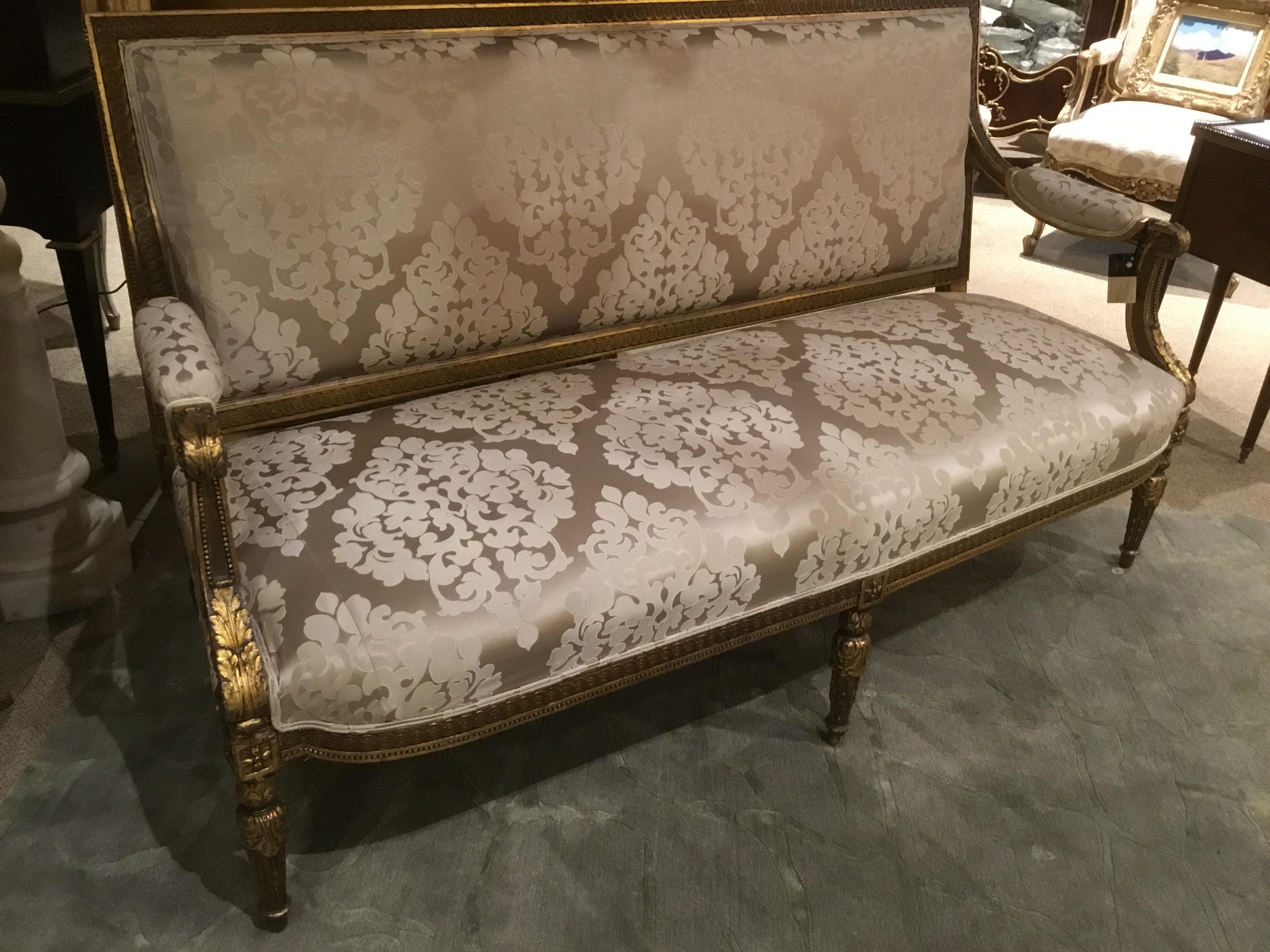 Beautifully carved settee in the Louis XVI-style with very fine carving
In the Kriege style. Reeded carved legs and curved arms embellish
This lovely piece. Foliate gilt arms and beading with gilt highlights
Make this piece exceptional.