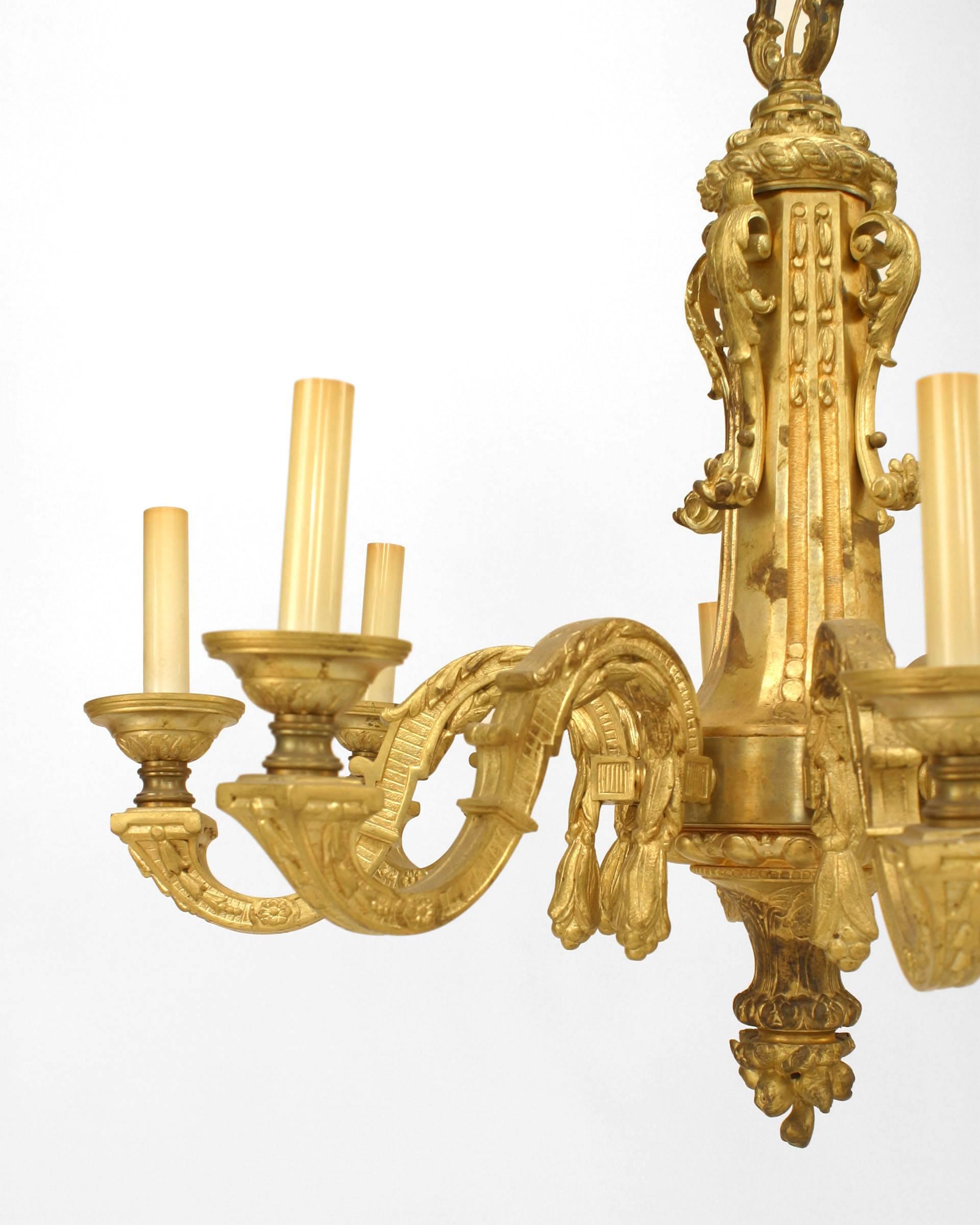 French Louis XVI-style (19th Century) gilt bronze chandelier with 8 scroll form arms emanating from a solid center shaft with a tapered finial bottom (with original chain)
