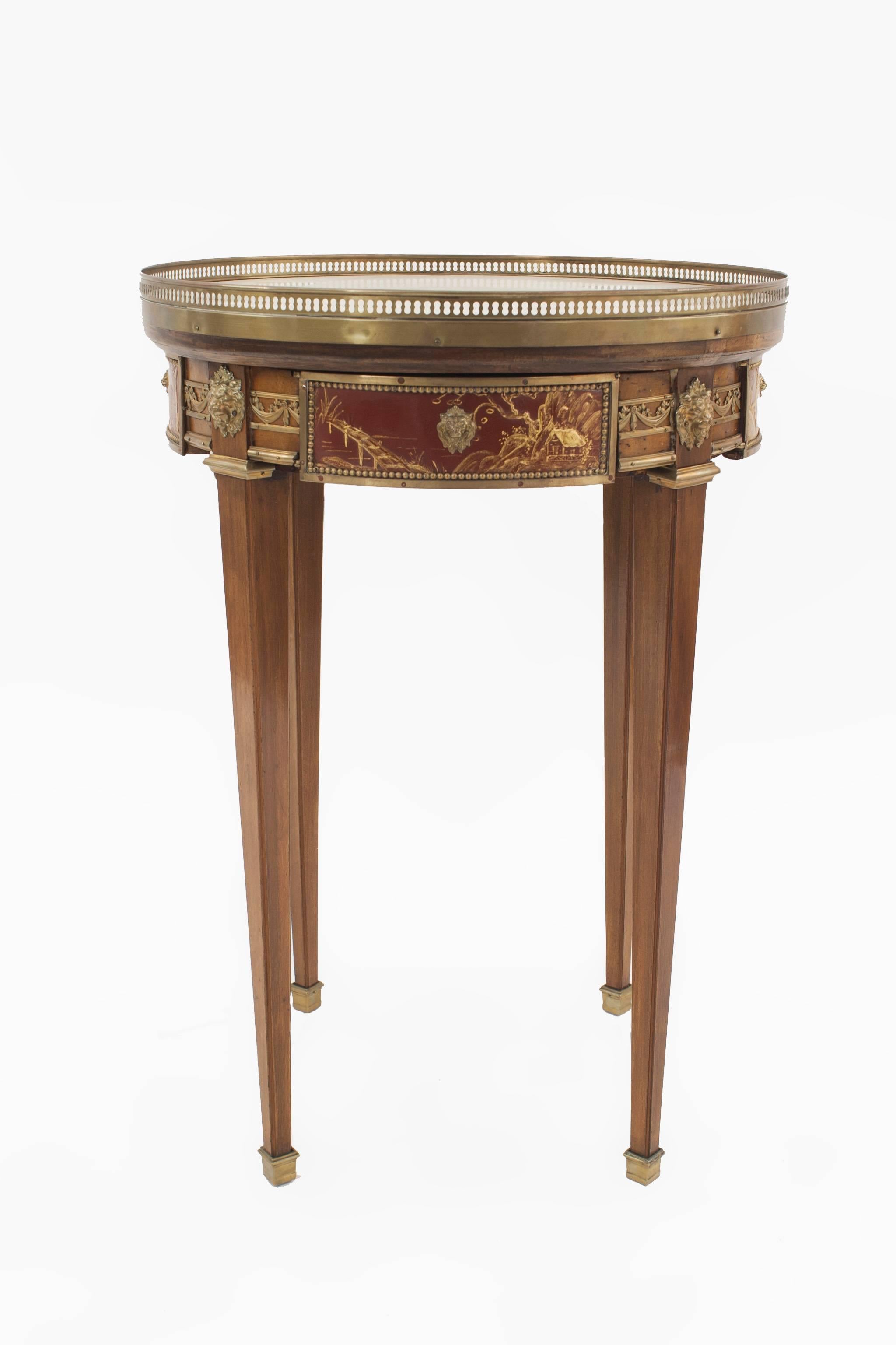 French Louis XVI-style (19th Century) mahogany and bronze trimmed mechanical end table with Chinoiserie apron and white marble top.
