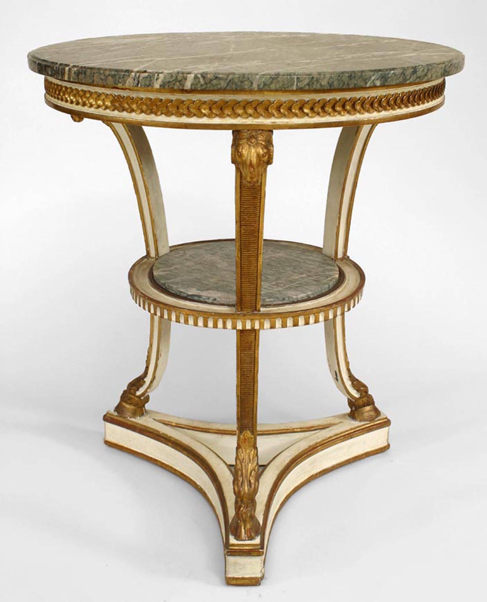 French Louis XVI-style (19th Century) white painted & gilt trim round gueridon table with 3 carved ram head legs and green marble top & shelf. (signed ESCALIER DE CRYSTAL, PARIS)
