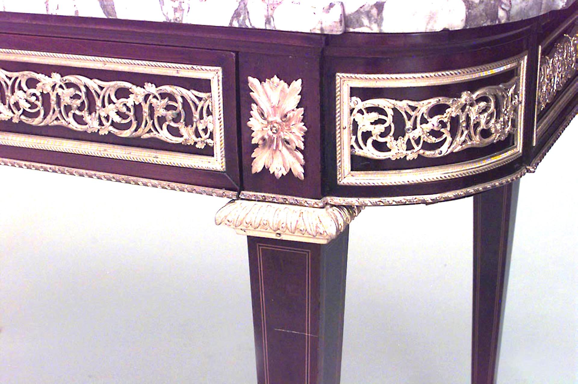 French Louis XVI style (19th Century) mahogany and inlaid single drawer center table with bronze trimmed apron and white marble top.
