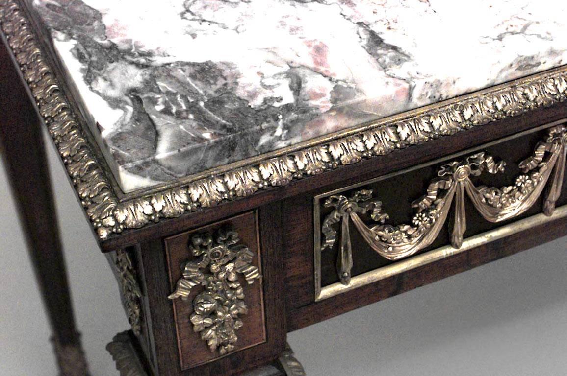 French Louis XVI style (19th Century) rectangular mahogany and bronze trimmed center table with cupid relief plaques & festoon design apron with marble top.
