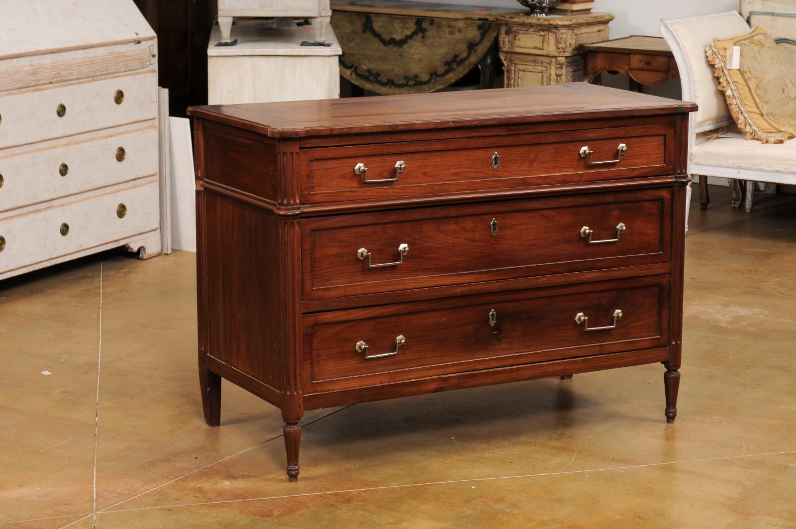 Carved French Louis XVI Style 19th Century Cherry Three-Drawer Commode with Fluting For Sale