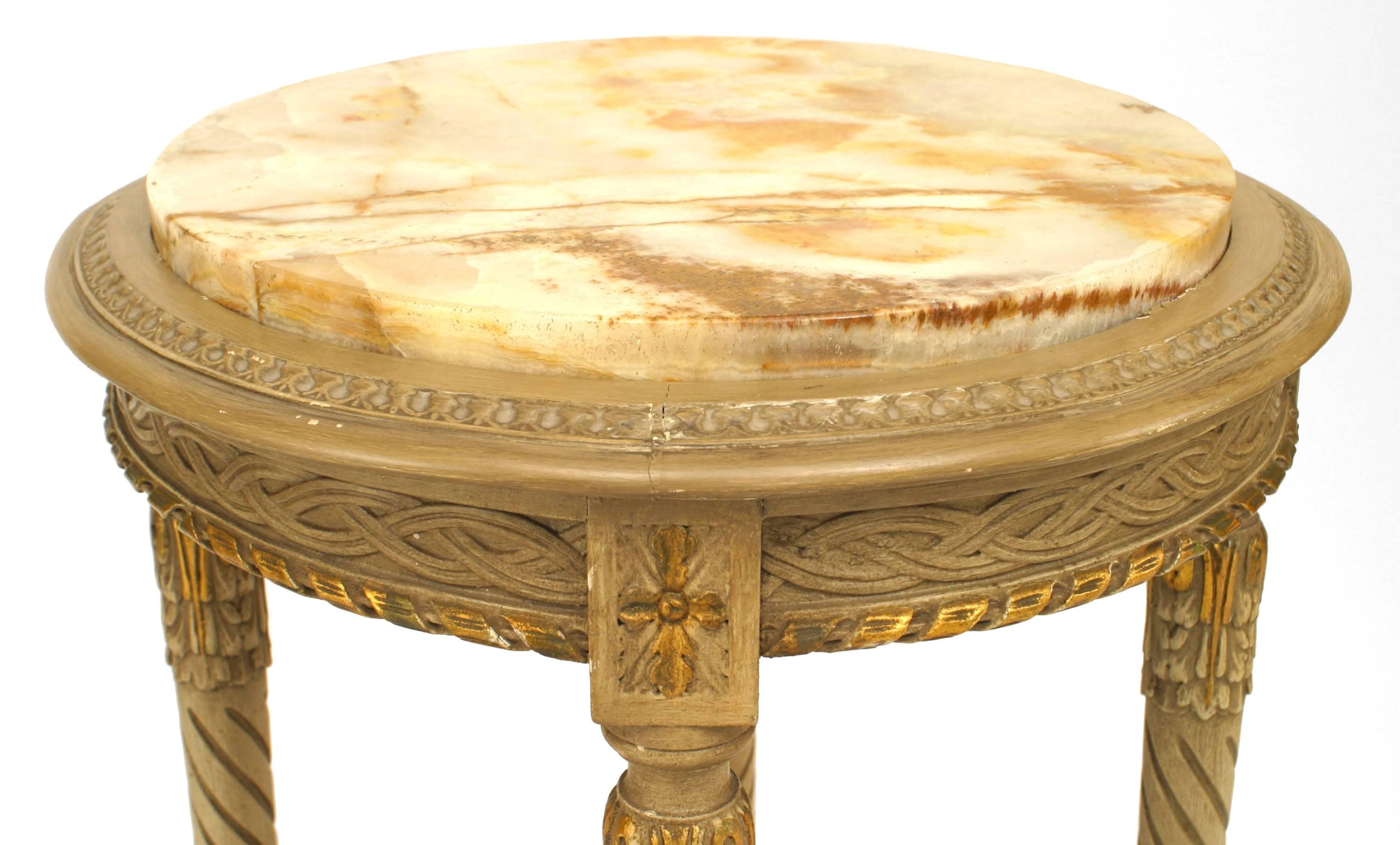 French Louis XVI-style (19th Century) grey painted end table with a cane shelf/stretcher and a round inset onyx marble top.
