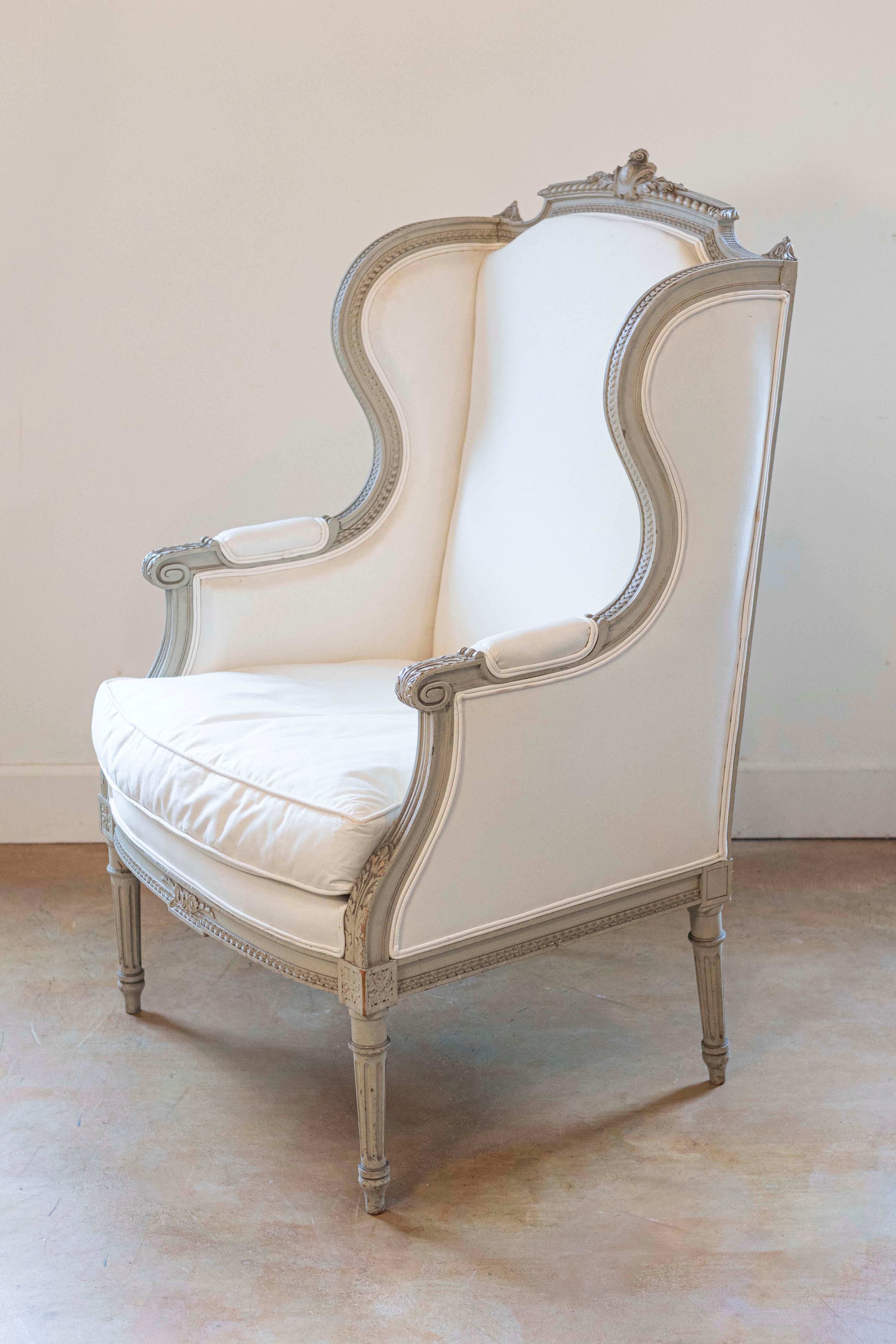 French Louis XVI Style 19th Century Painted and Carved Wingback Bergère Chair In Good Condition For Sale In Atlanta, GA