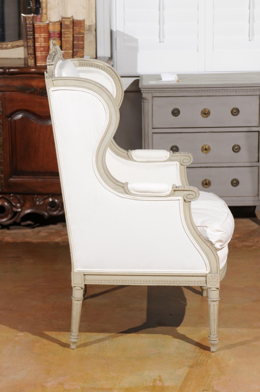 French Louis XVI Style 19th Century Painted and Carved Wingback Bergère Chair In Good Condition For Sale In Atlanta, GA