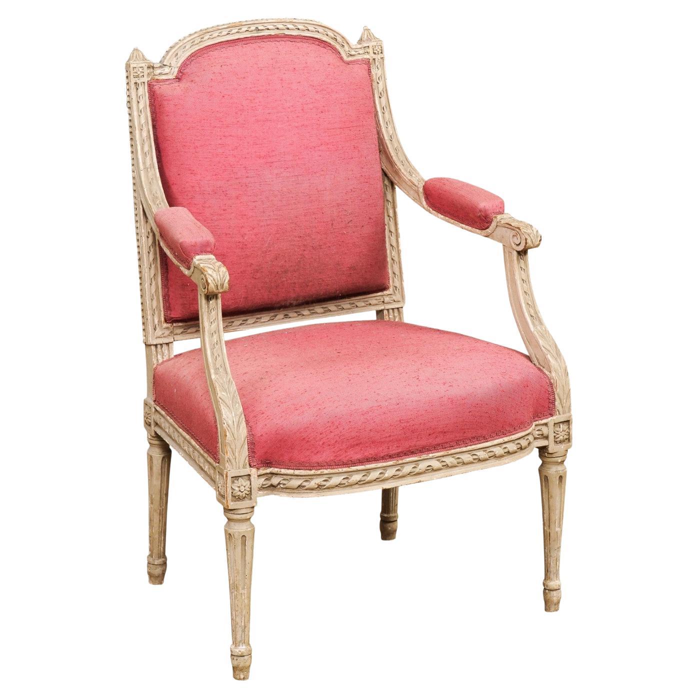 French Louis XVI Style 19th Century Painted Fauteuil with Abundant Carved Décor For Sale