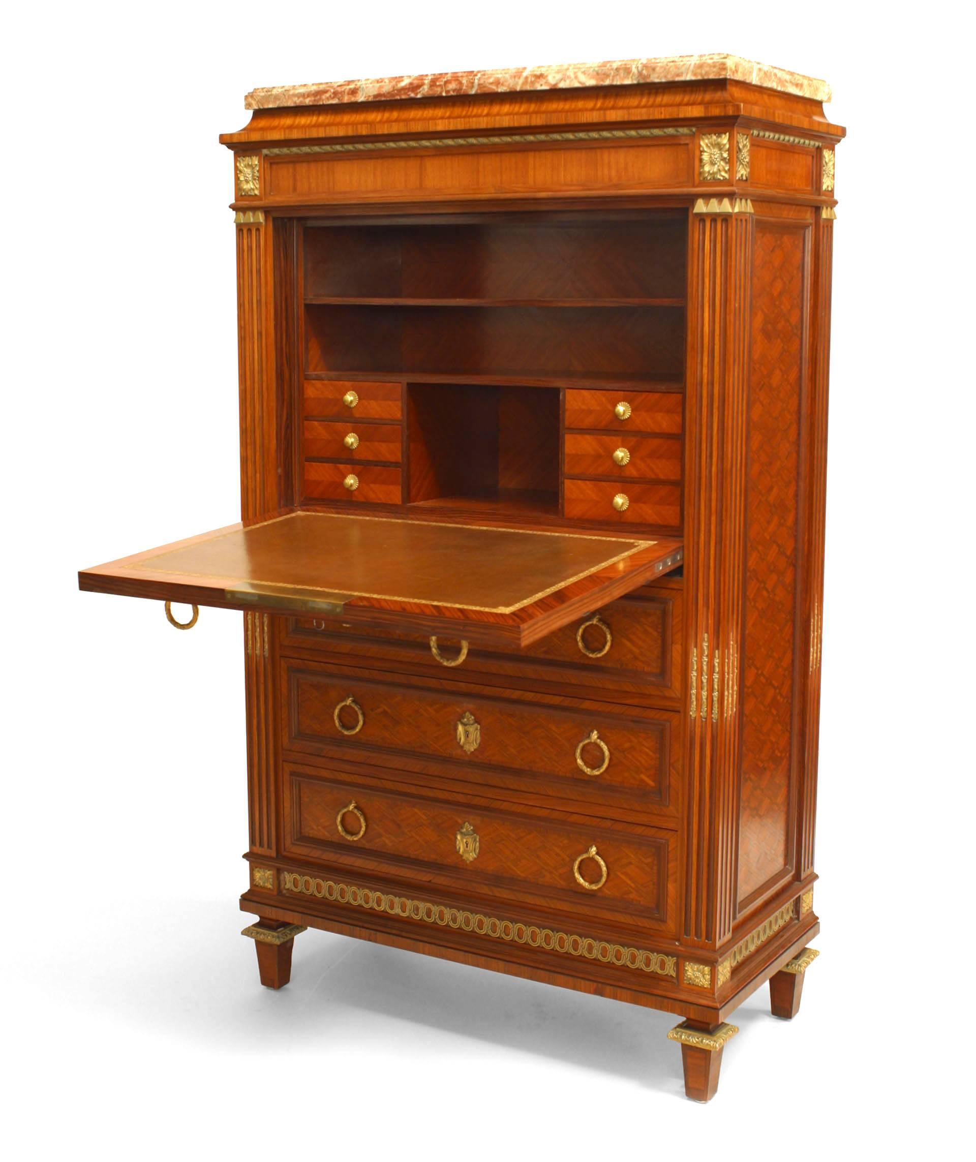 French Louis XVI style 19th century parquetry inlaid drop front secretary (abattant) with gilt bronze trim and ring hands with four drawers below a fitted interior with a leather writing surface.
 