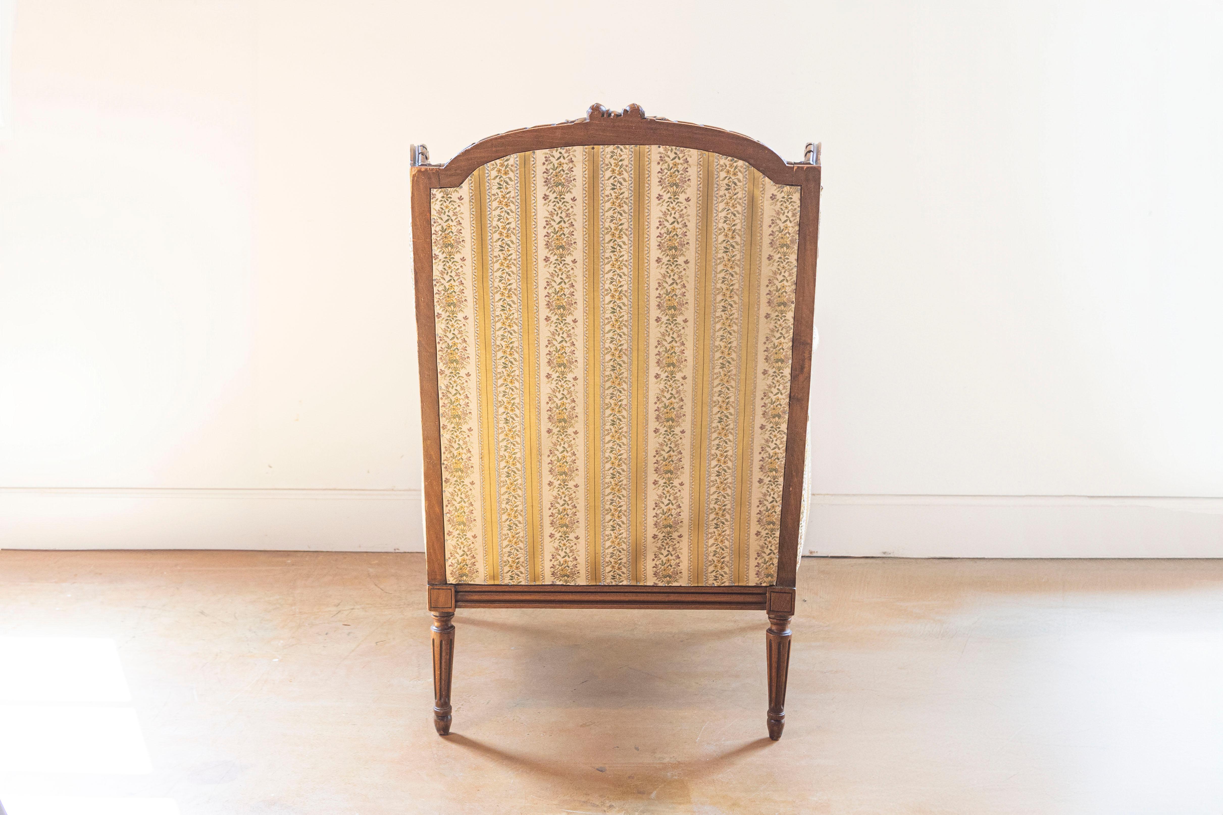 Upholstery French Louis XVI Style 19th Century Walnut Bergère à Oreilles with Carved Roses For Sale