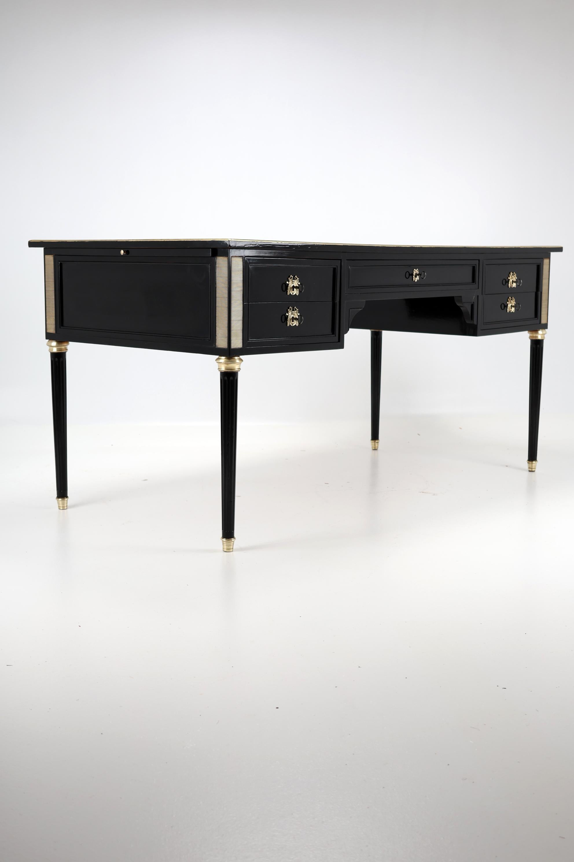 French Louis XVI Style Antique Ebonized Desk
France, 1900
Mahogany, ebonized

Antique French Louis XVI style ebonized desk made of mahogany with five dovetailed drawers, each with working locks and keys and rich gilt bronze decor and accents.
The