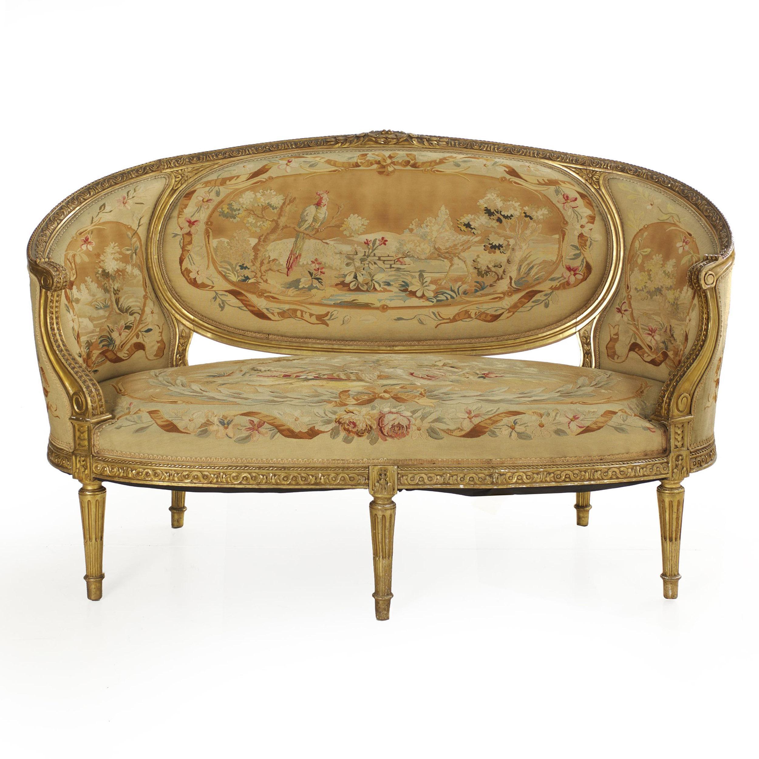 An exquisite and rare five-piece salon suite in the Louis XVI taste from the last quarter of the 19th century, it features a single canapé and four matched fauteuils covered in an original needlepoint Aubusson. The covering is incredibly