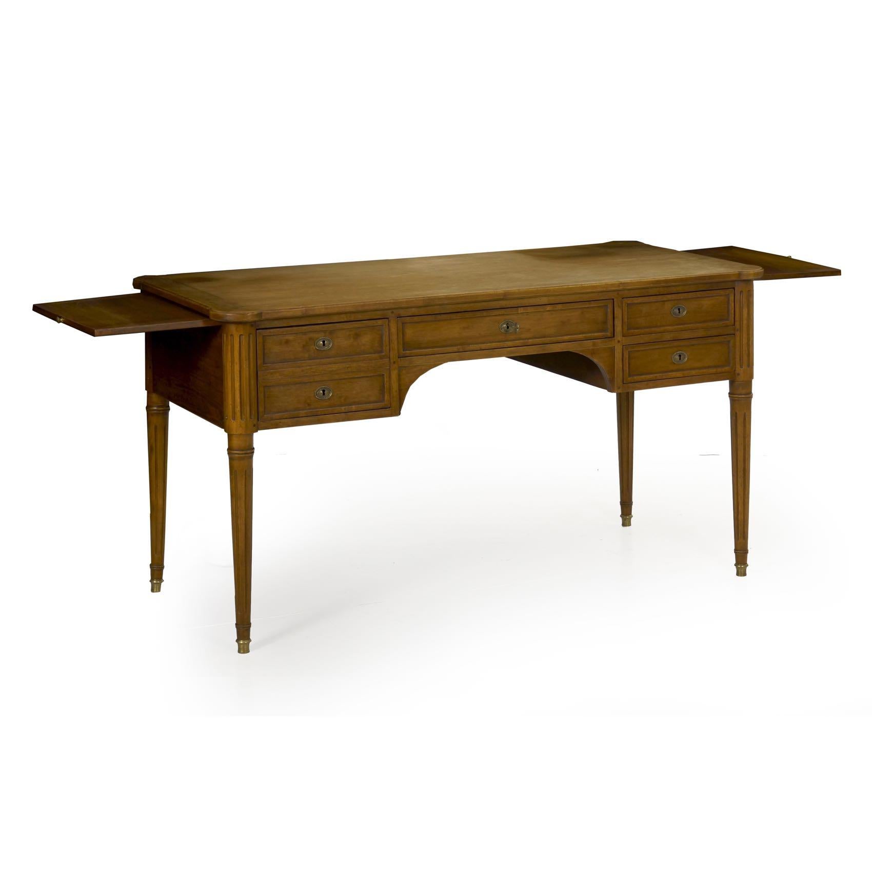 This attractive bureau plat is crafted in the Louis XVI taste during the middle of the 20th century, executed in solid fruitwood. It is true to the original forms with tenon-mortised joints locked together with twin pegs. Built to last the test of