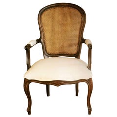 Antique French Louis XVI Style Armchair Carved Walnut with Caned Backrest