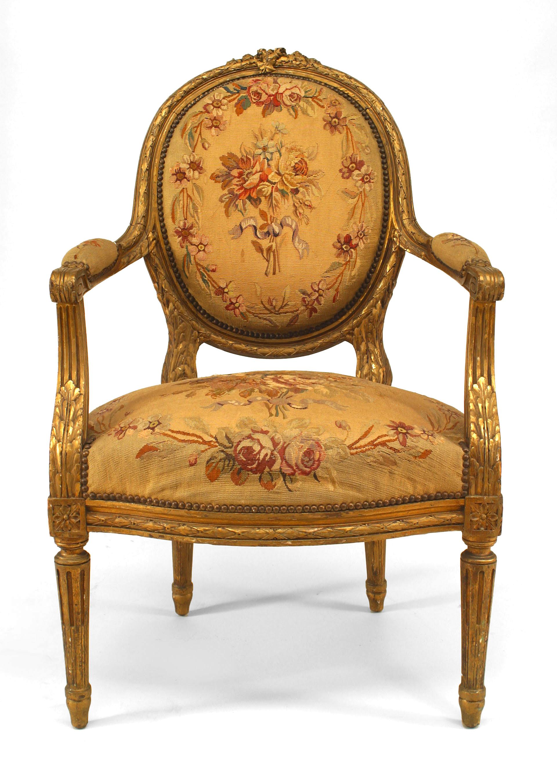 Four French Louis XVI style (19th century) gilt oval back Aubusson upholstered armchairs. (4-priced each)
 