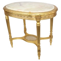 Table centrale ovale en bois doré sculpté de style Louis XVI Belle Époque avec plateau en onyx