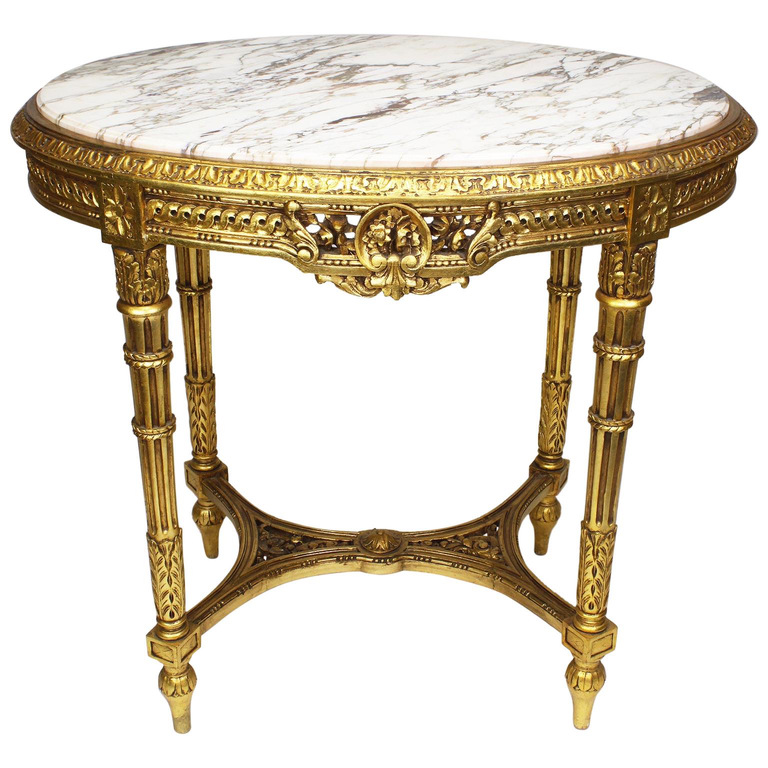 Französischer Louis XVI Stil Belle Époque Ovaler Tisch mit geschnitzter Marmorplatte aus Giltholz im Angebot