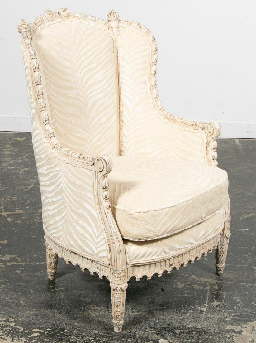 French Louis XVI style bergère, arm or wingback chair in a fine silk velvet upholstery attributed to Maison Jansen. The finest carvings possible on this bell flower motif frame with raised carved acanthus leaf legs. The whole having a great painted
