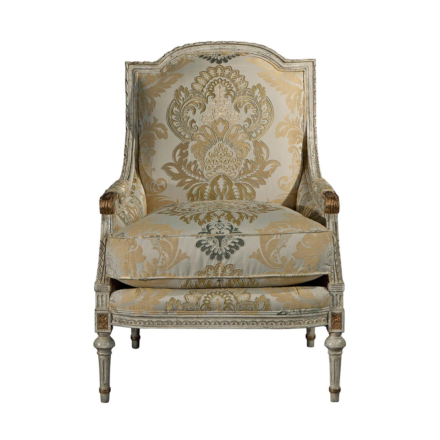 A finely carved fauteuil, the paper twist carved, arched top rail and downswept padded arms with scroll terminals enclosing an upholstered back and cushion seat, on a finely carved seat rail with flowerhead capitals to the turned and fluted legs.