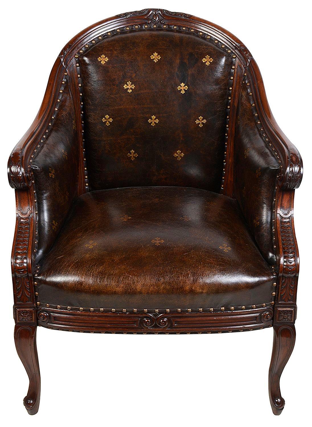 A very impressive and stylish French Mahogany Bergere, Library arm chair in the Louis XVI style. Having wonderful hide upholstery with gilded motif decoration, carved show wood and raised on elegant cabriole legs.

Batch 78 C/C