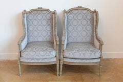 French Louis XVI Style Bergères À Oreilles with Carved Motifs and Upholstery