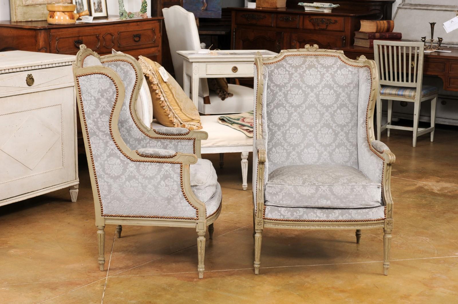 20th Century French Louis XVI Style Bergères À Oreilles with Carved Motifs and Upholstery For Sale