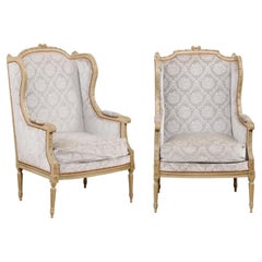 Antique French Louis XVI Style Bergères À Oreilles with Carved Motifs and Upholstery