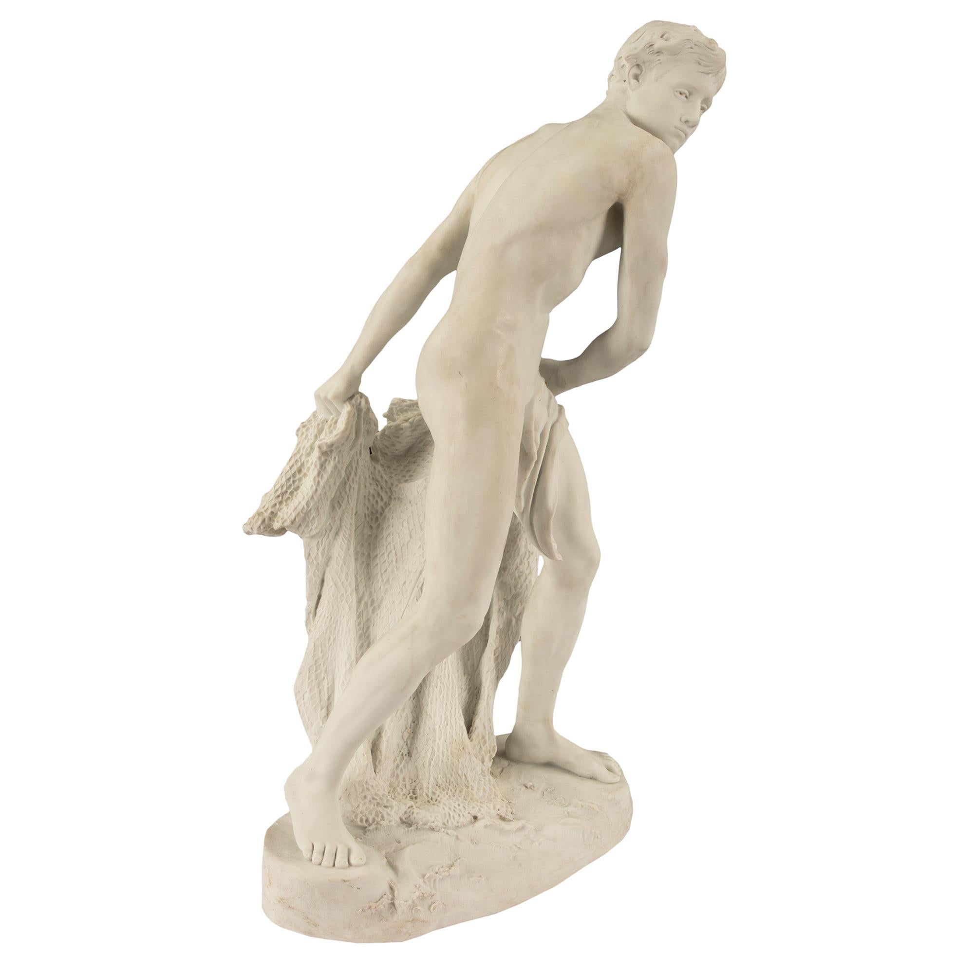 A handsome French 19th century Louis XVI st. Biscuit de Sèvres porcelain statue of a fisher boy. The statue is raised by an oblong terrain design base with small waves. The fisher boy is draped in a flowing fabric and holds his finely detailed and