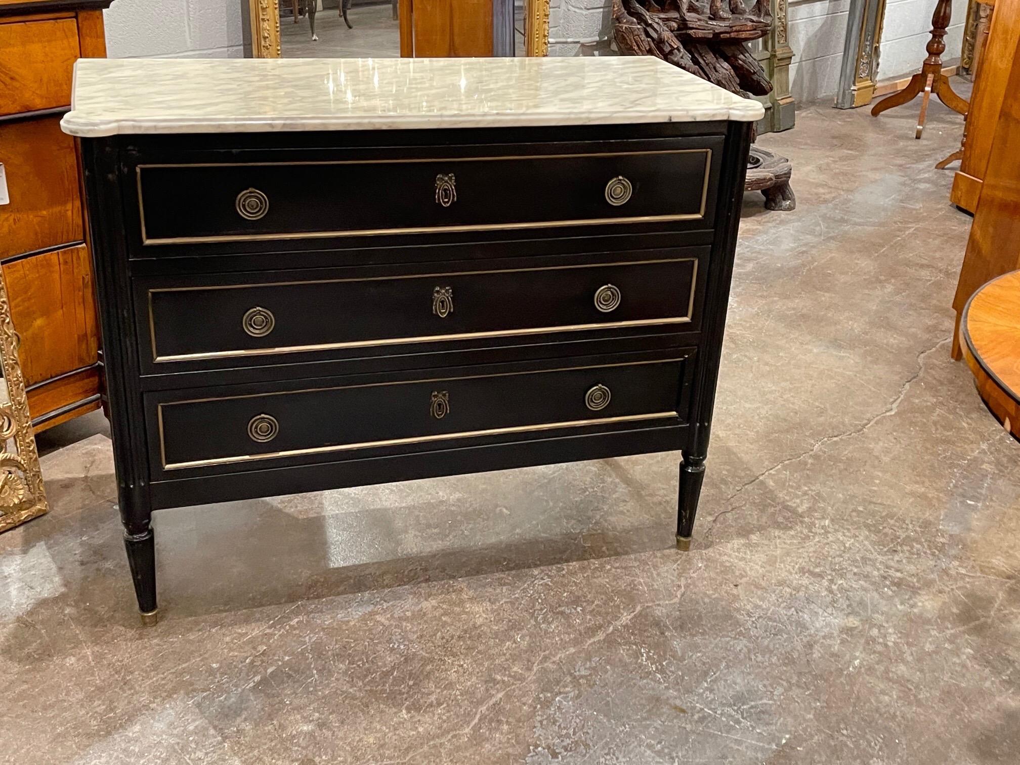 Elegant French Louis XVI style black lacquered chest with beautiful marble top. Nice brass hardware and details as well. A Classic piece!!