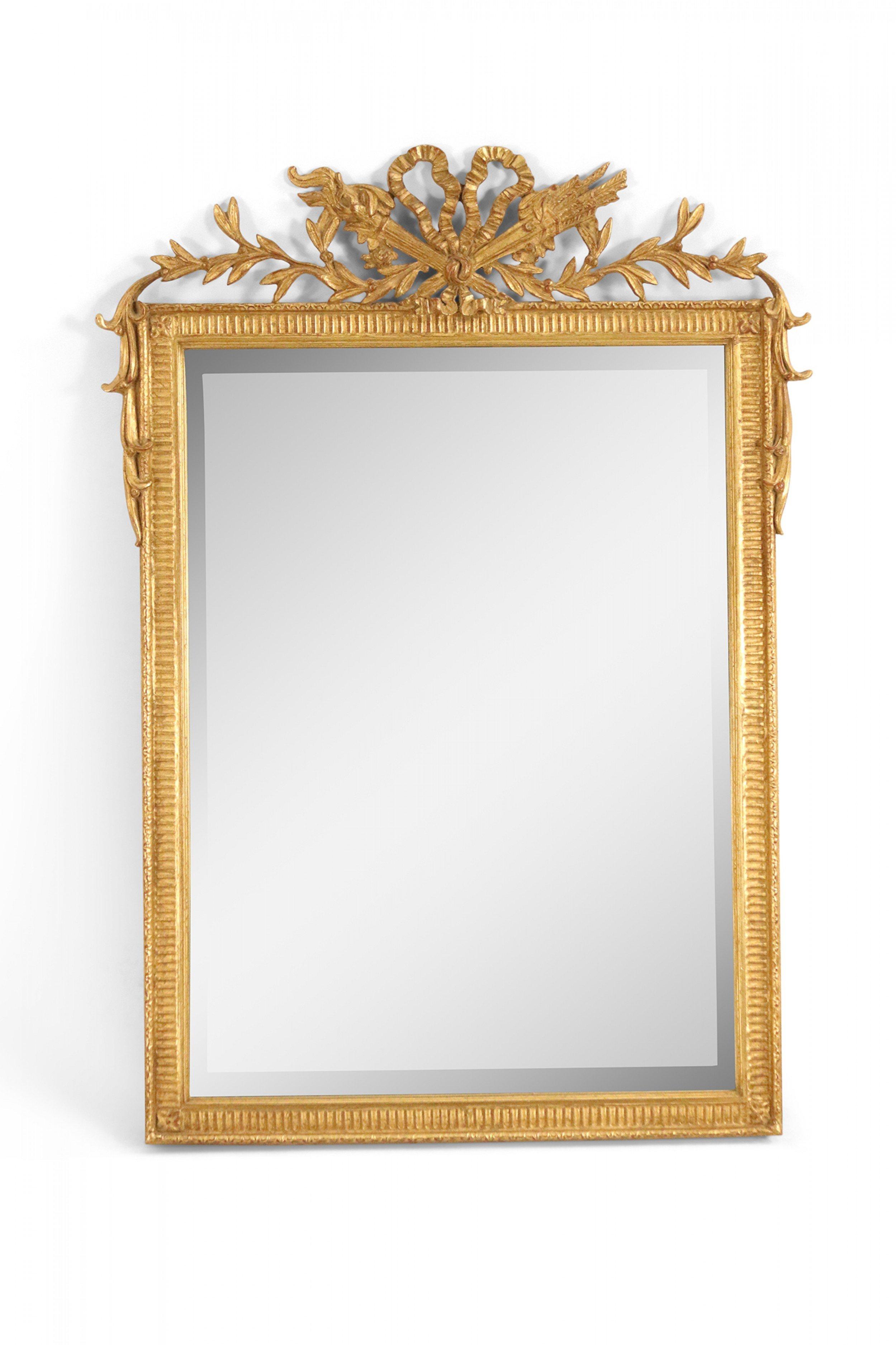 French Louis XVI-style giltwood rectangular wall mirror with a carved frame and a bow knot pediment top.