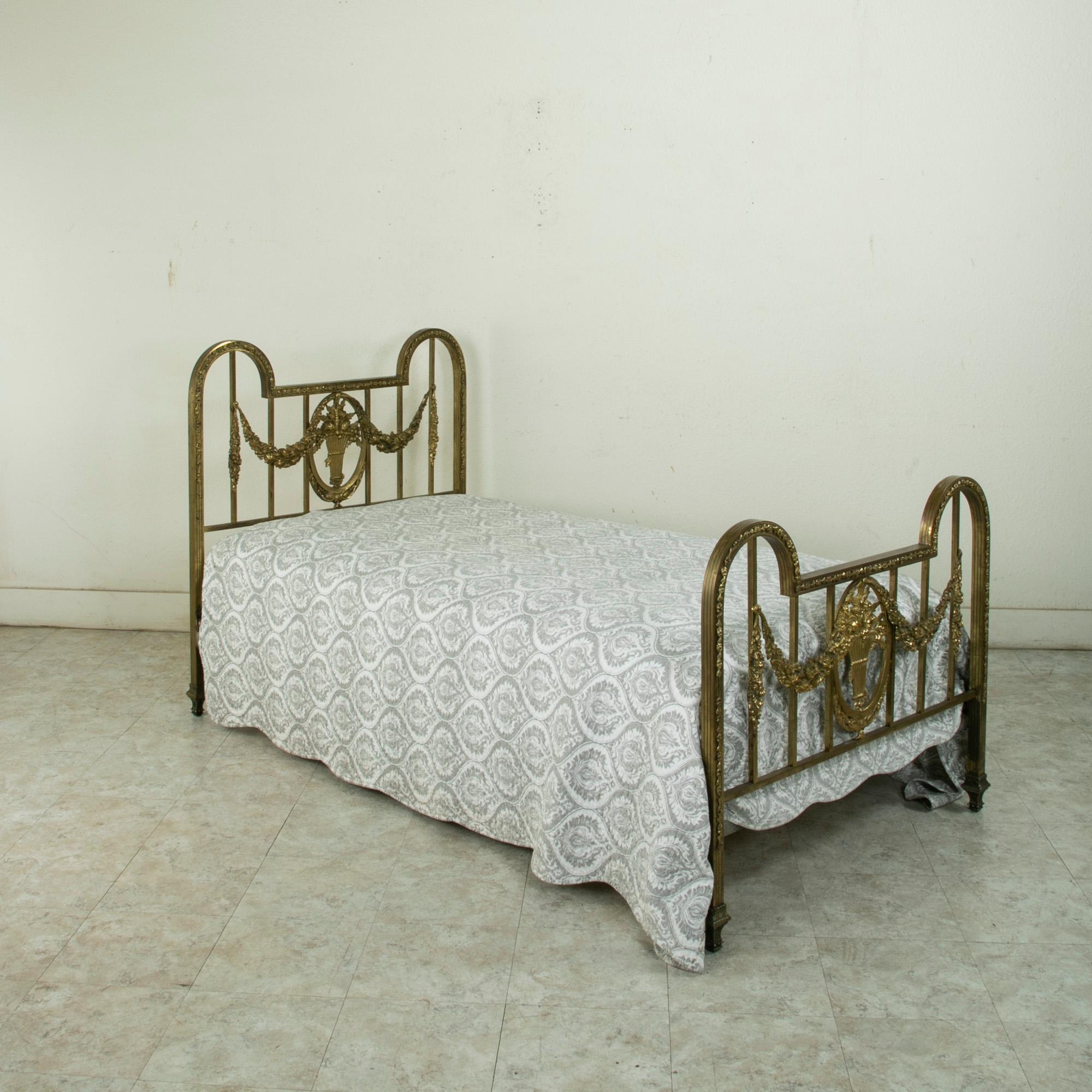 Early 20th Century French Louis XVI Style Brass Twin Bed with Basket and Garlands, circa 1900