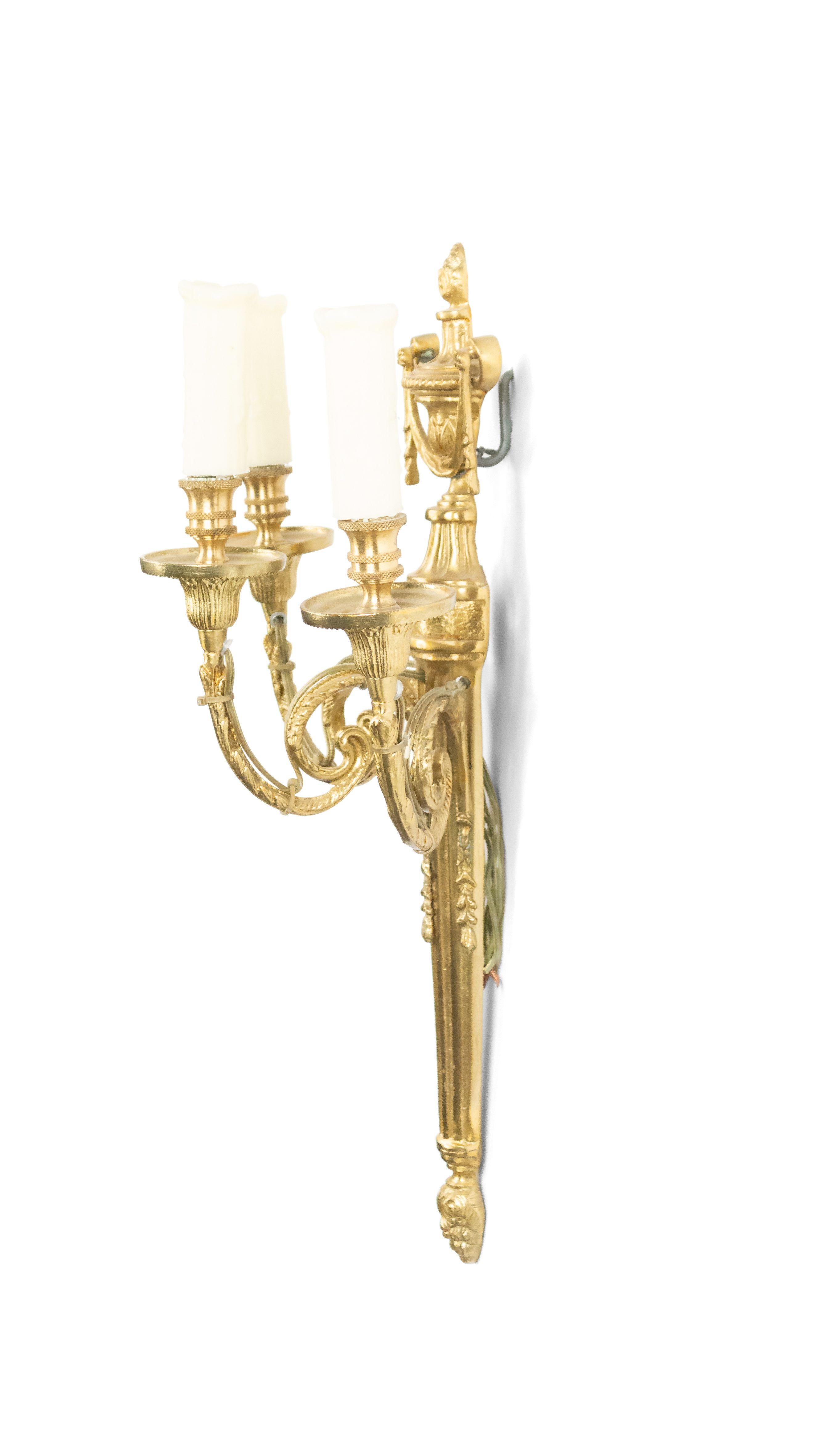5 French Louis XVI-style (late 20th Century) brass wall sconces with three scroll arms and urn shaped tops. (PRICED EACH).
 