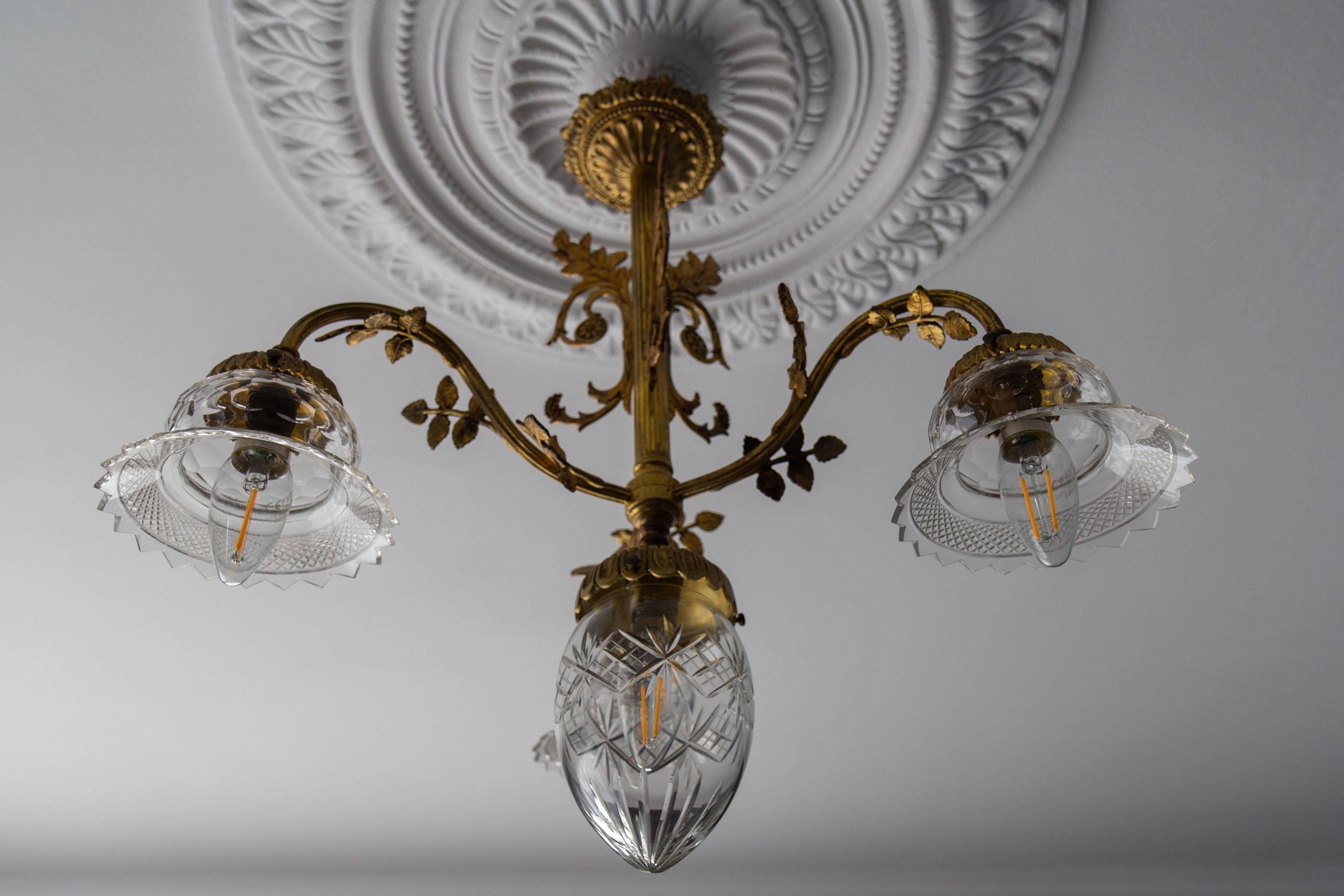 Brass French Louis XVI Style Bronze and Clear Cut Glass Four-Light Chandelier For Sale