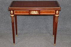 Table à plateau rabattable de style Louis XVI, en bronze et marqueterie, signée Gervais Durand