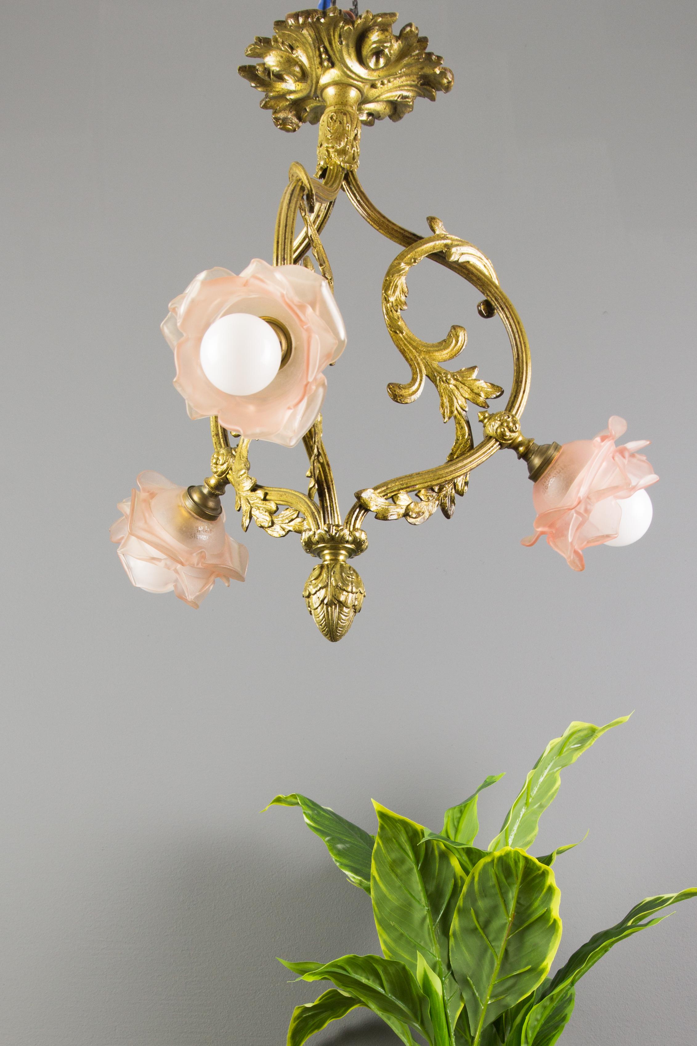 Early 20th Century French Louis XVI Style Bronze and Pink Frosted Glass Three-Light Chandelier