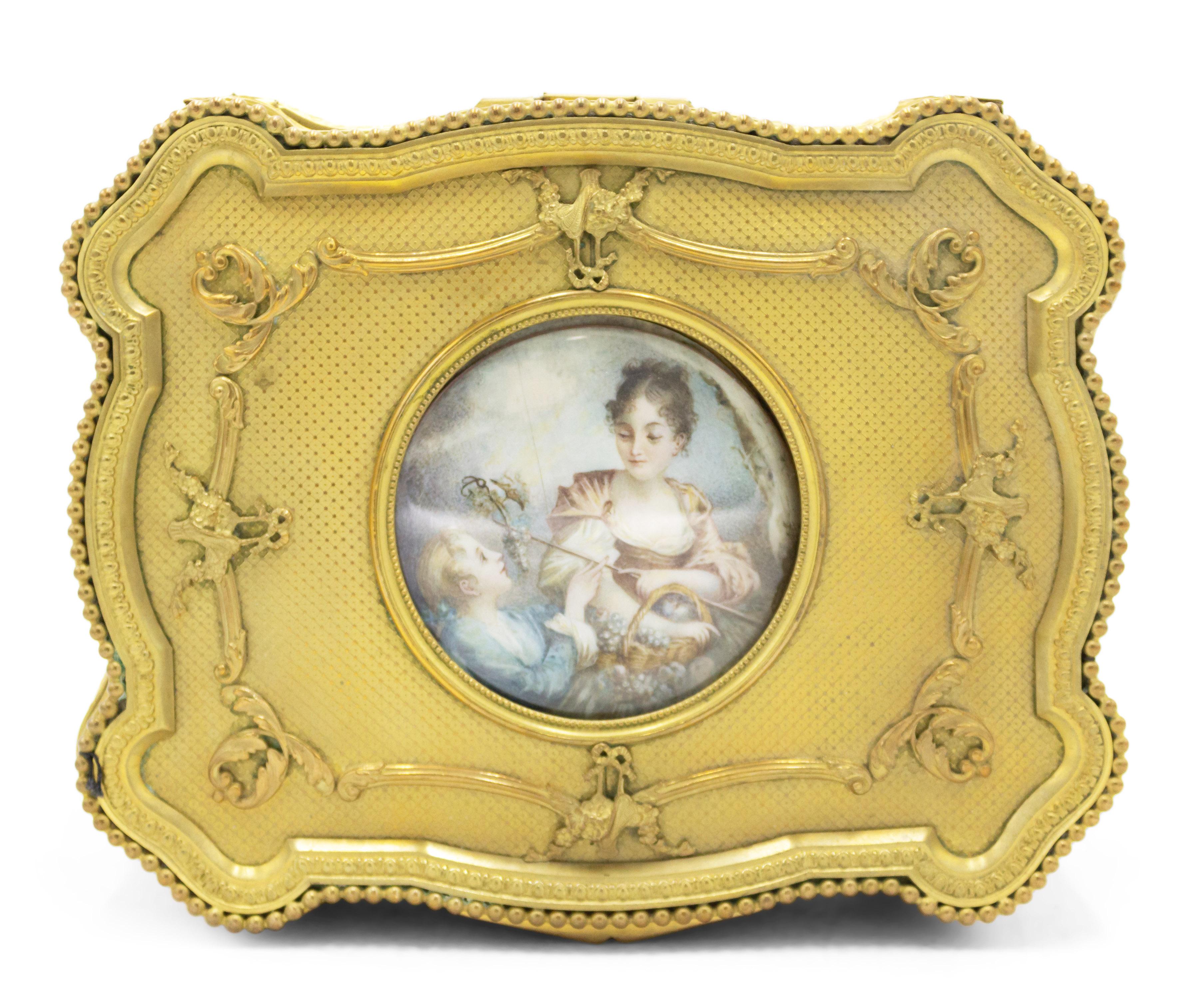 French Louis XVI-style (19/20th century) bronze dore rectangular shaped jewel box with round plaque of lady and man.
    