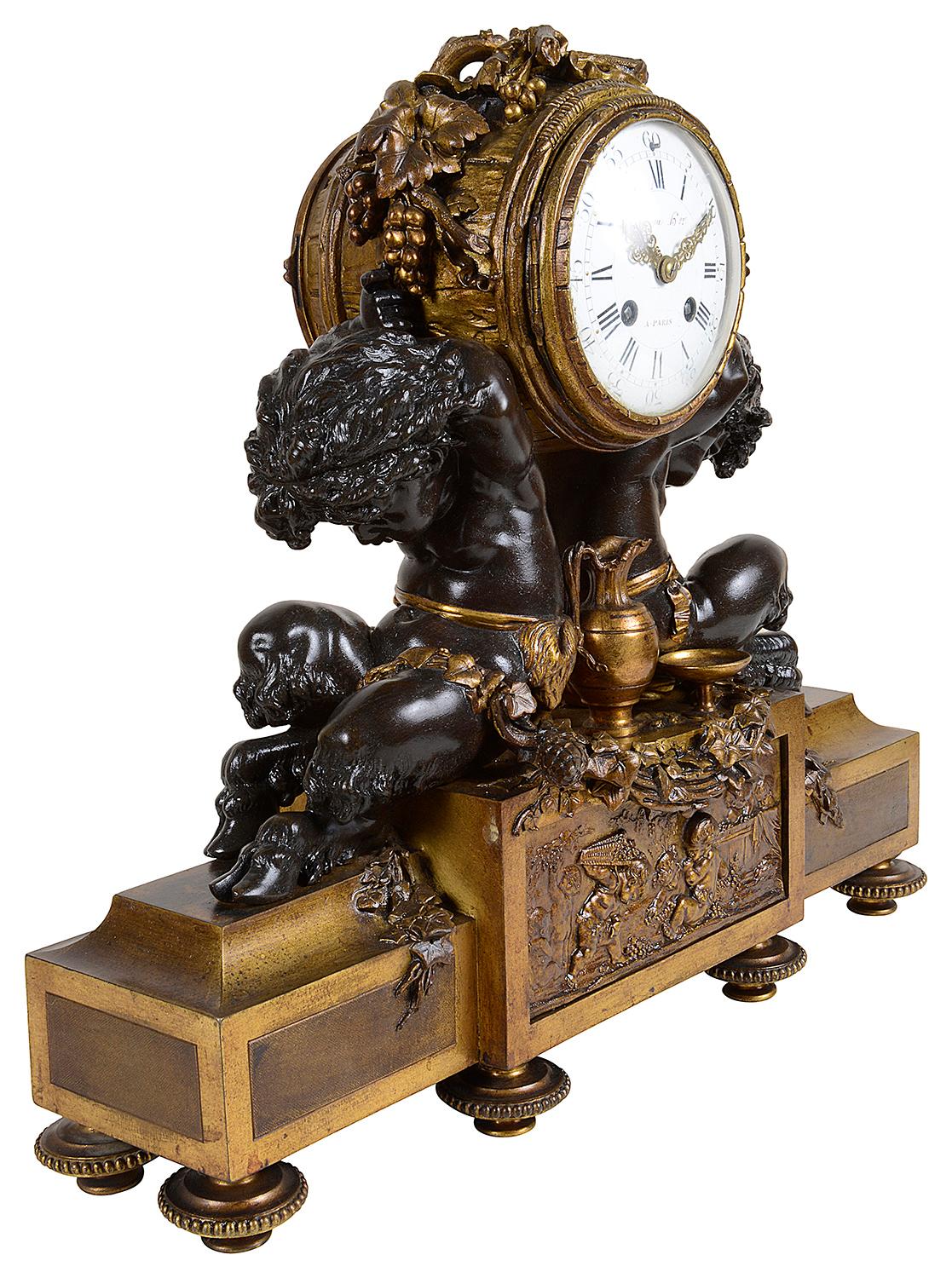 A very good quality 19th century French gilded ormolu and bronze Louis XVI style mantel (fireplace) clock, have cloven hoofed putti supporting the clock, with Bacchus influenced decoration around and to the panel in the center. The white enameled
