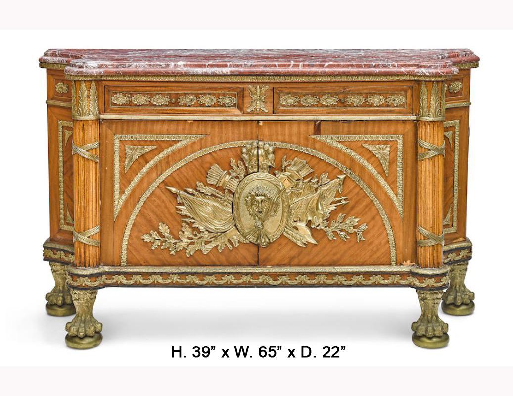 Impressive and large French Louis XVI style bronze mounted commode, 20th century.

Thick moulded and shaped marble top is over a conforming gilt bronze mounted frieze decorated in a laurel leaf and foliage motif, fitted with two short drawers,