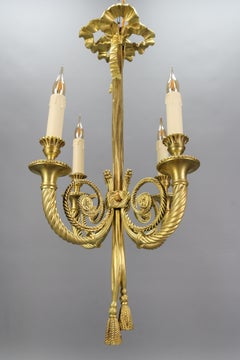French Louis XVI Style Bronze Ribbon and Tassel Four-Light Chandelier, 1910s