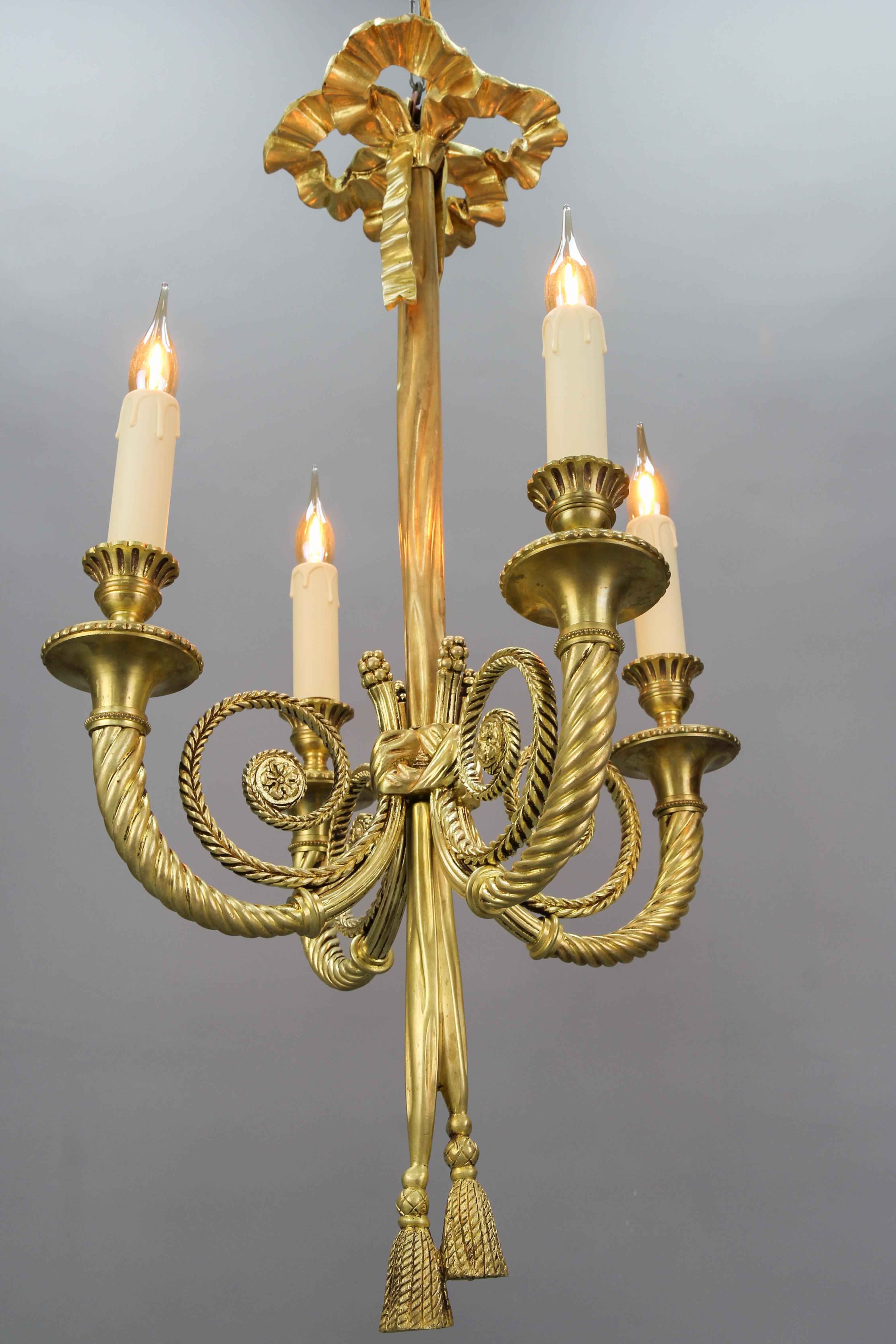 Early 20th Century French Louis XVI Style Bronze Ribbon and Tassel Four-Light Chandelier, 1910s For Sale