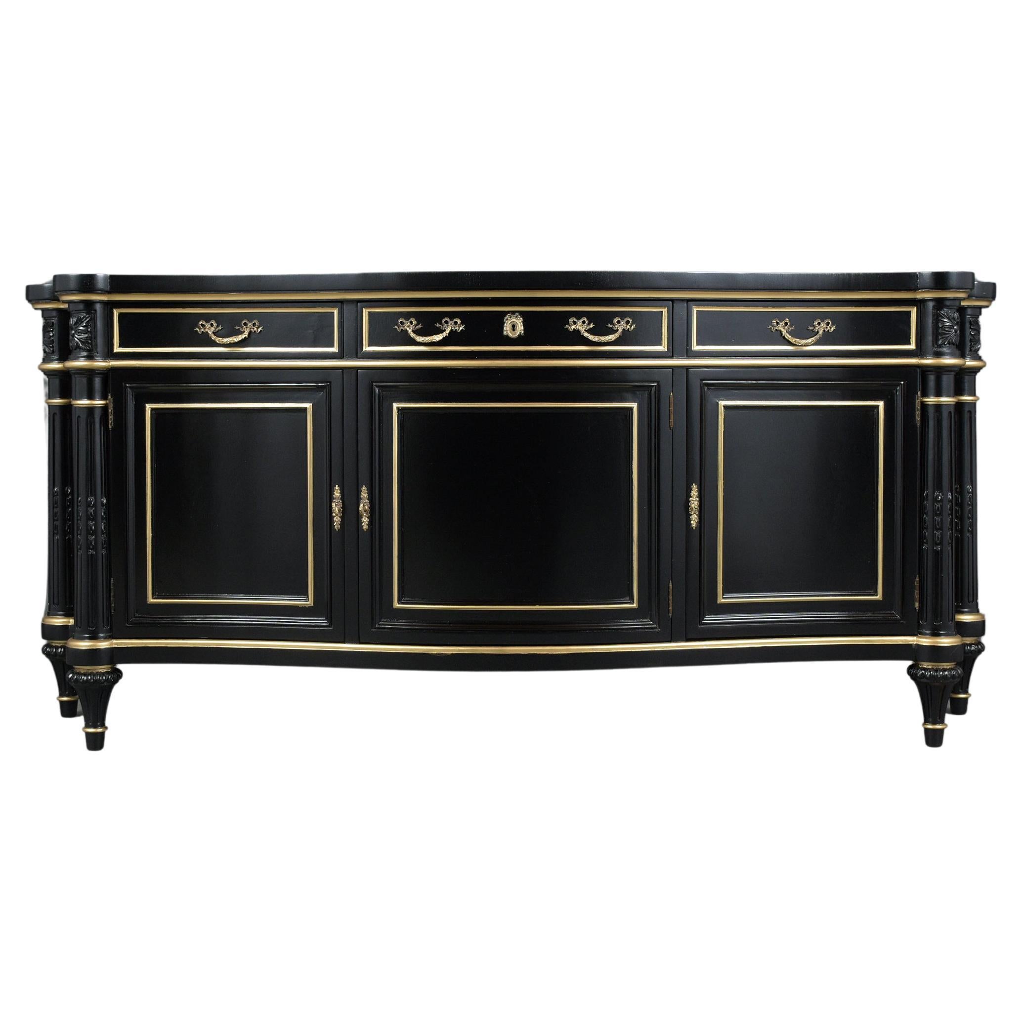 An extraordinary Louis XVI style 1950s server hand-crafted out of mahogany wood professionally restored by our craftsmen team. This buffet features new elegant ebonized color and gilt molding accents details with a lacquer finish, a serpentine top
