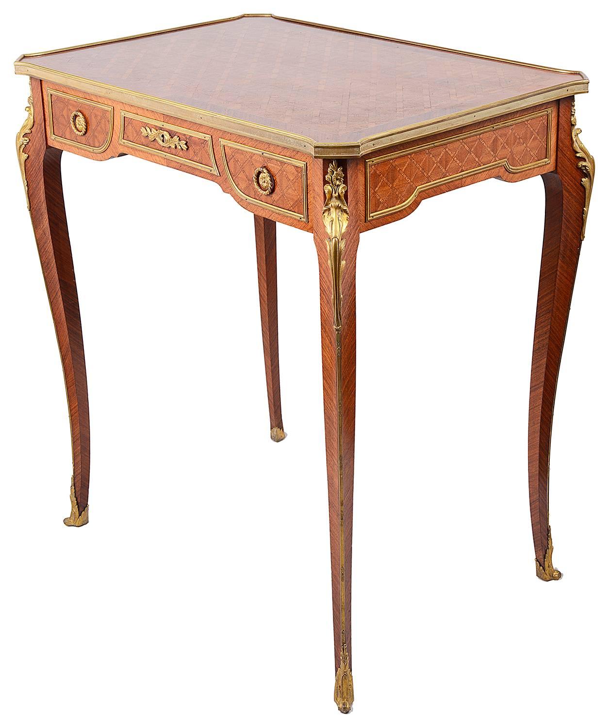 A good quality late 19th century French Kingwood parquetry inlaid Bureau plat. Having ormolu mounts, three mahogany lined frieze drawers and raised on elegant tapering legs.